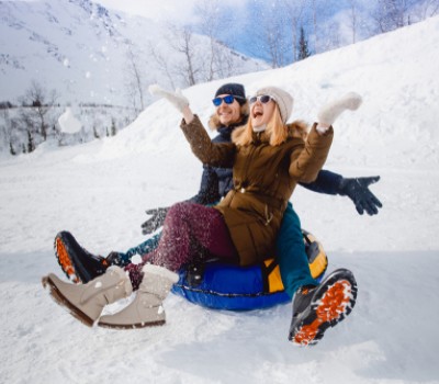 couple tubing in snow