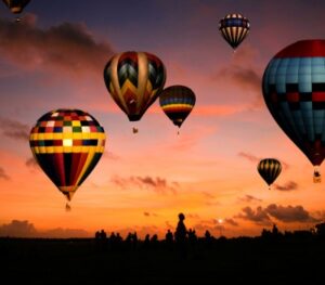 hot air balloons at sunset