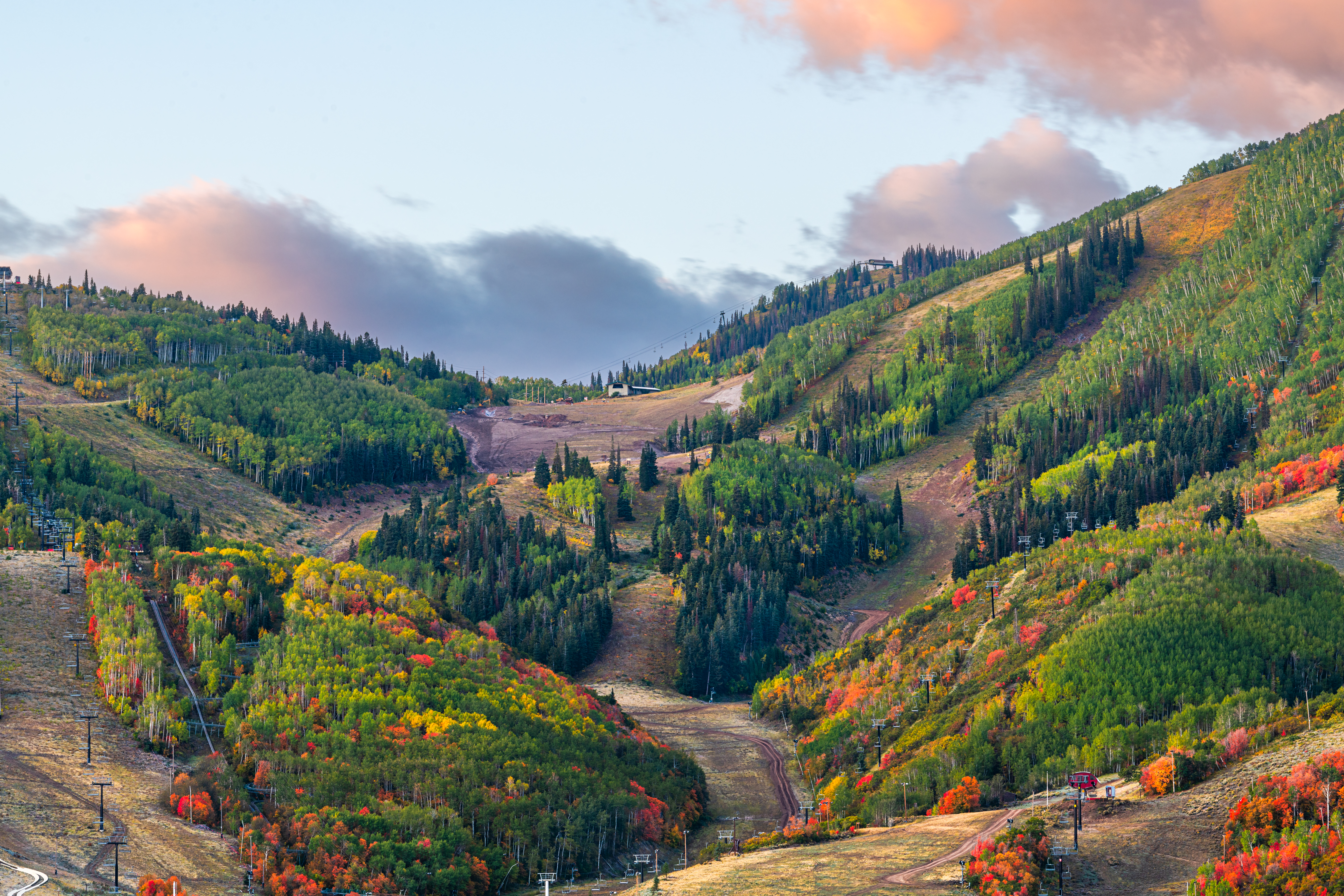 Park City, Utah, USA snowless ski slopes in autumn during the morning time.
