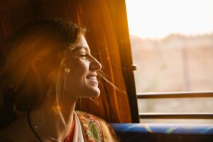 woman smiling out window